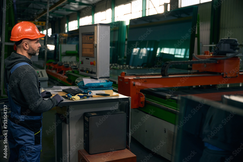 Window production employee in the workshop at the workplace Window production employee in the workshop at the workplace