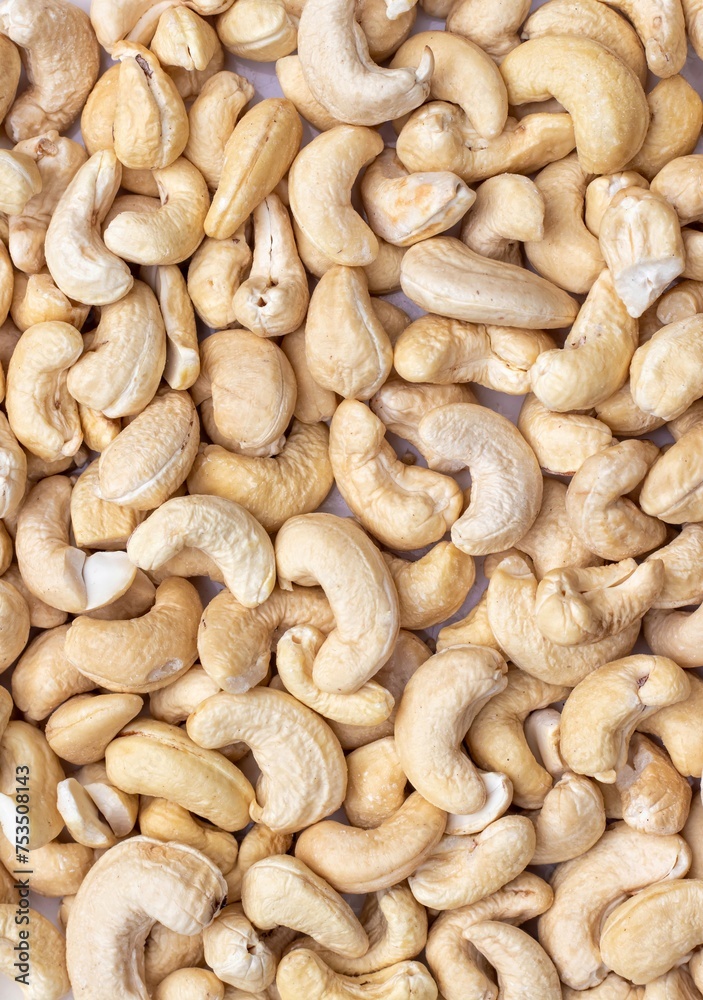 Top View of Cashew Nut Background in Vertical Orientation with Copy Space Top View of Cashew Nut Background in Vertical Orientation with Copy Space