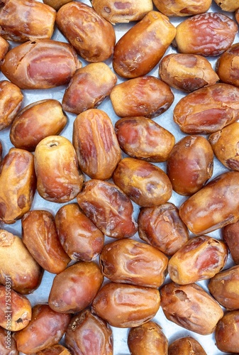 Top View of Phoenix Dactylifera or Date Palm Fruit Background in Vertical Orientation