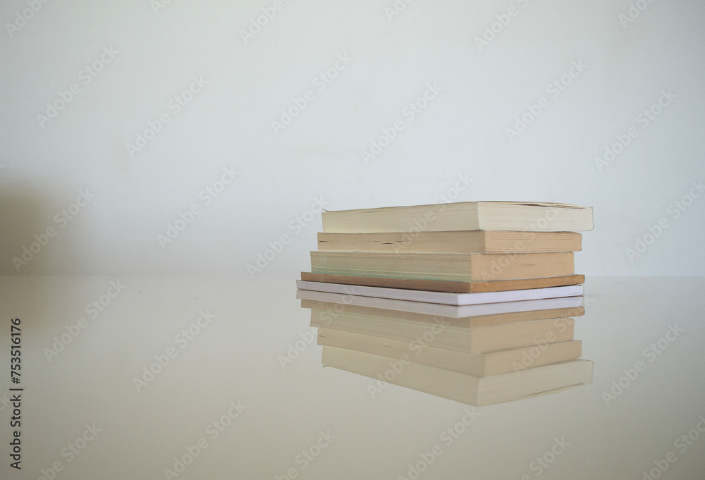some books on a white table some books on a white table