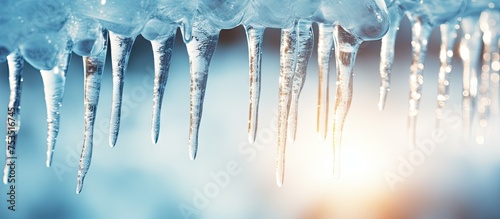 Sparkling icicles dangle gr...