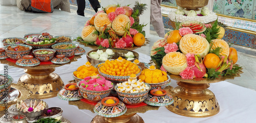 Food offerings to the Emerald Buddha, Wat Phra Kaew, Thailand. photo