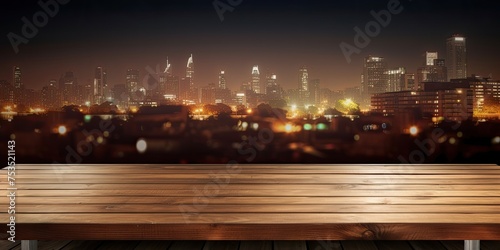 Empty wooden table in front of pub at night as background panorama. © Vusal