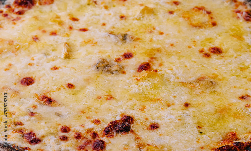 black pizza with cheese close up