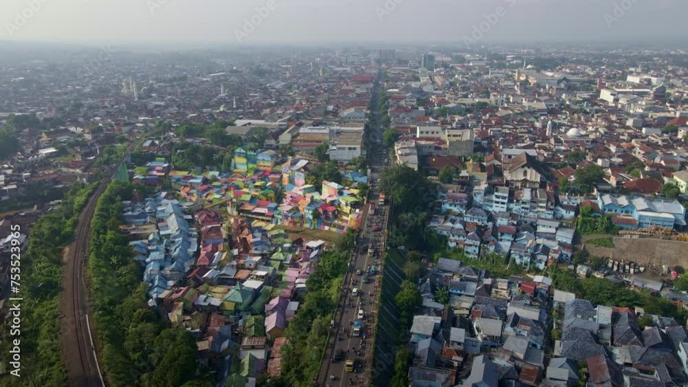 bustling streets and densely populated areas of Indonesia, portraying the vibrancy of urban life intertwined with the harsh realities of poverty and pollution. aerial 4k drone footage. bustling streets and densely populated areas of Indonesia, portraying the vibrancy of urban life intertwined with the harsh realities of poverty and pollution. aerial 4k drone footage.