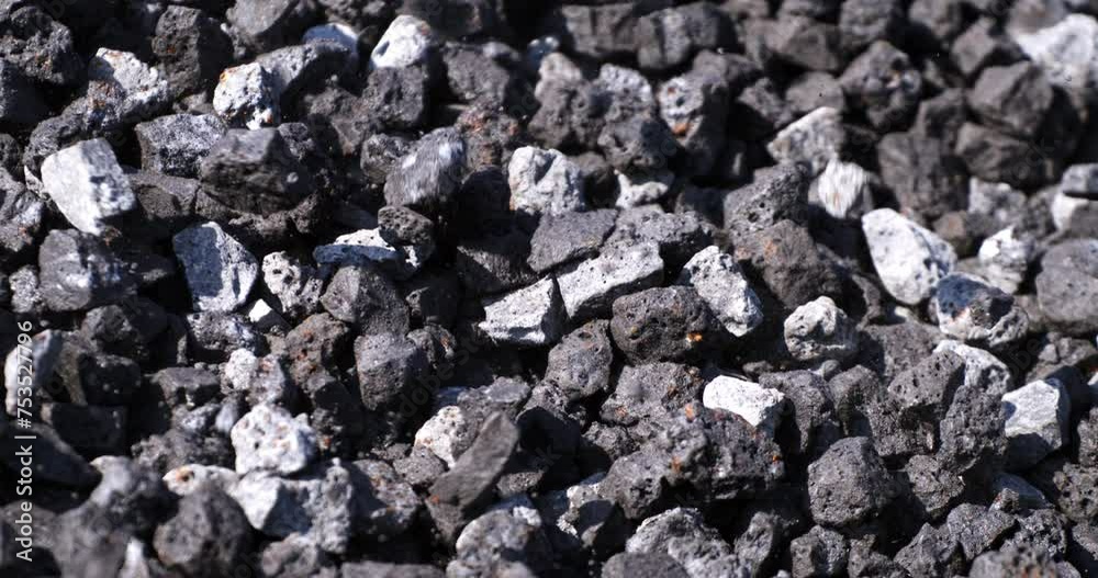Super slow motion close up of falling gravel stones on ground during quality control and sorting process at concrete plant industrial factory at 1000 fps. Super slow motion close up of falling gravel stones on ground during quality control and sorting process at concrete plant industrial factory at 1000 fps.