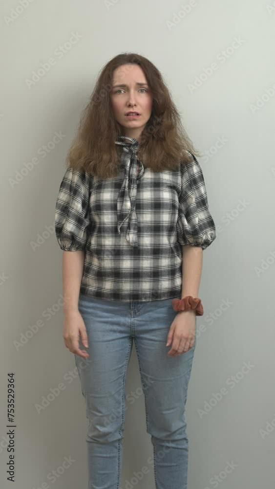 Disappointed girl being fed up with something, expressive hand gestures. Vertical video. Disappointed girl being fed up with something, expressive hand gestures. Vertical video.