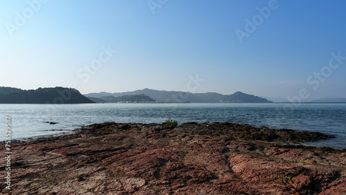 Coastal rocks and distant harbor