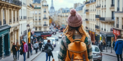 Fototapeta Naklejka Na Ścianę i Meble -  Woman sightseeing and admiring the cityscape in Paris, France.