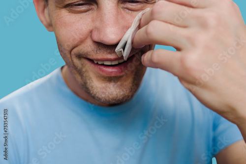 Happy young man sniffing tea bag and smelling aroma. Smell rehab: Patient undergoes olfactory rehabilitation therapy