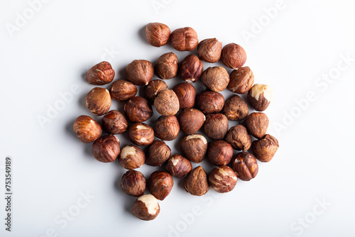 Hazelnuts on a white background. Top view, flat lay
