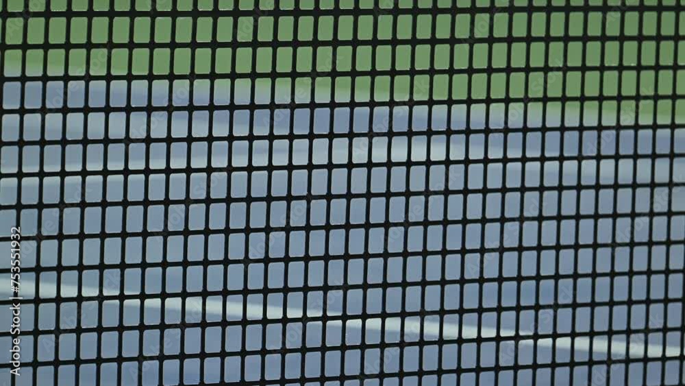 A close-up view showcasing the rubber composition of a professional tennis net tailored for ATP events A close-up view showcasing the rubber composition of a professional tennis net tailored for ATP events