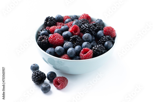 Fresh assortment berries in bowl isolated on white background