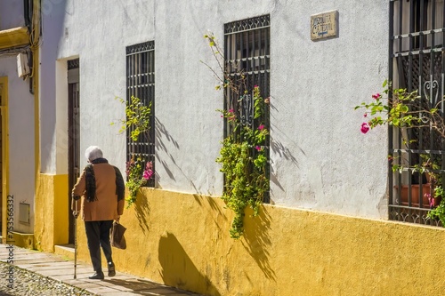 Grandma walking in the street in Cordoba in Andalusia, Spain