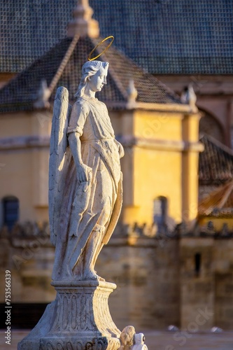 Angel statue on the Roman bridge of Cordoba in Andalusia, Spain