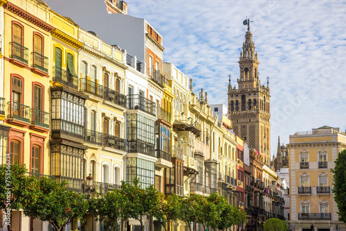 Avenida de la Constitucion street with Sevilla Cathedral tower in Seville, Spain photo