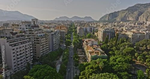 Palermo Italy Aerial v10 low drone flyover main thoroughfare Via della Liberta capturing street traffic, residential cityscape, town square and mountainous views - Shot with Mavic 3 Cine - May 2023 photo