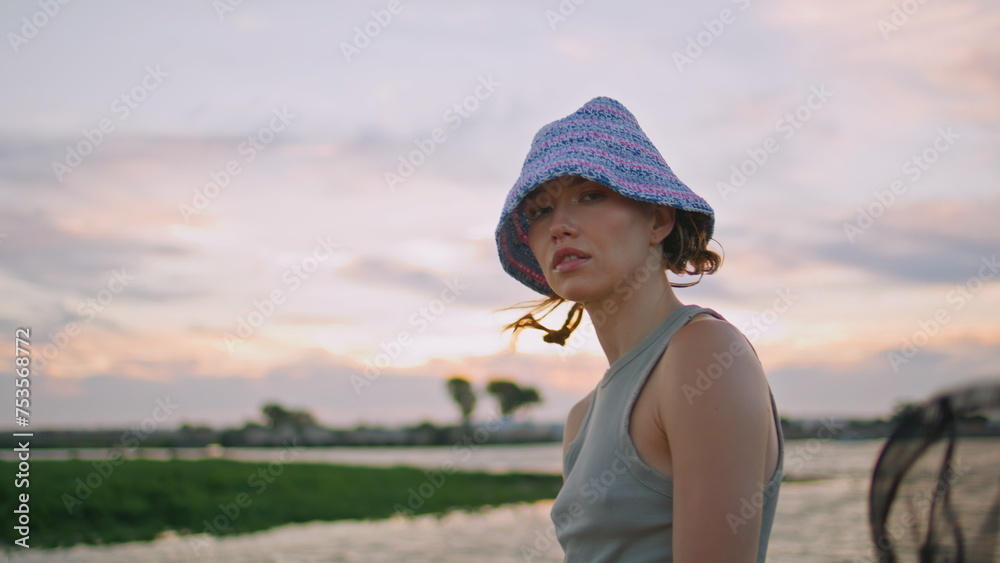 Calm model resting river on beautiful evening closeup. Serene casual girl posing