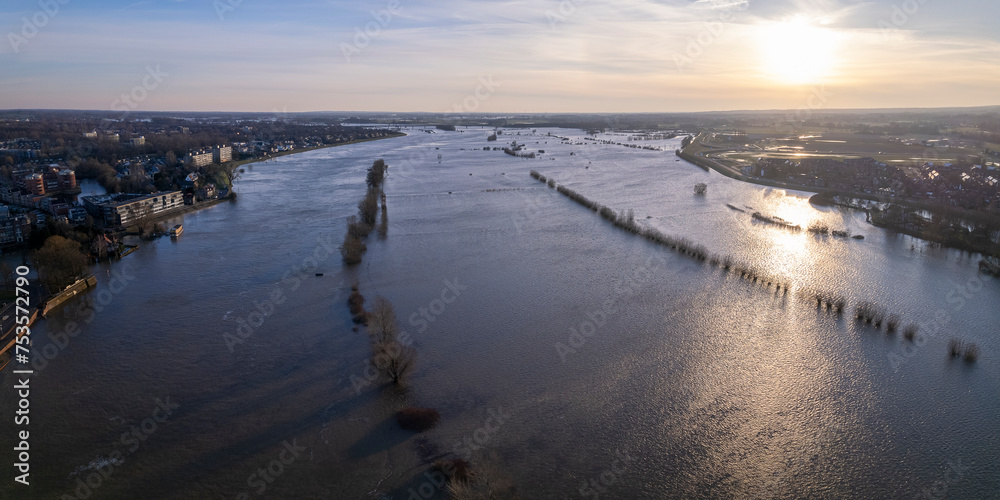 Panorama aerial showing extreme high water level of river IJssel in Zutphen, The Netherlands with inundated floodplains and waterway out of its normal flow riverbanks