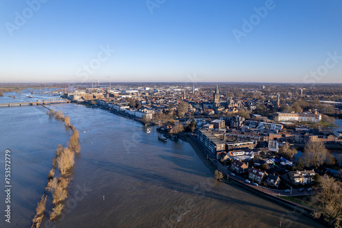 Aerial of river IJssel passing Dutch tower town Zutphen, The Netherlands