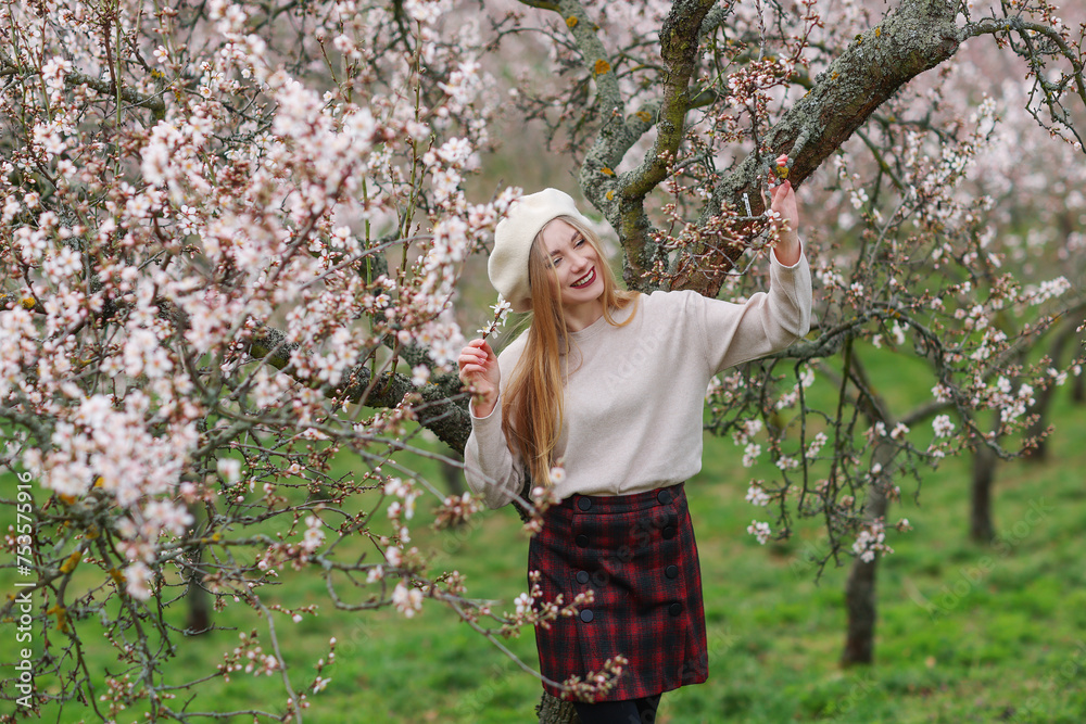 Spring coming. Beautiful woman walking in spring tree garden. Beauty People Lifestyle concepts. Spring coming. Beautiful woman walking in spring tree garden. Beauty People Lifestyle concepts.