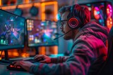Focused male gamer streaming online with vibrant LED lights