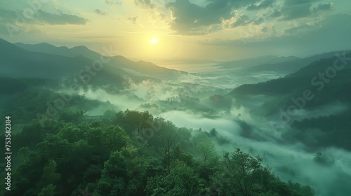 The sun rises, casting a warm light over a breathtaking landscape of mist-filled valleys nestled between green mountain ridges.
