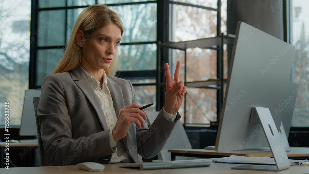 Caucasian adult middle-aged business coach entrepreneur tutor mentor woman communicate by video call. Mature businesswoman speaking computer online conference distance office chat e-learning teaching