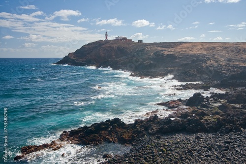 view of the coast of island with lighthouse