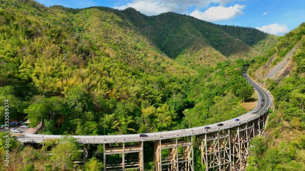 Aerial view of bridge over highway road in green of National park Aerial view of bridge over highway road in green of National park