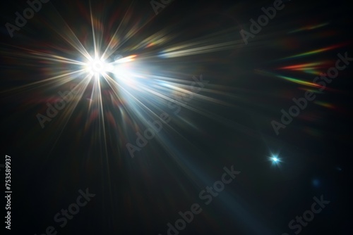 Abstract blurred colorful lens flare bokeh on black