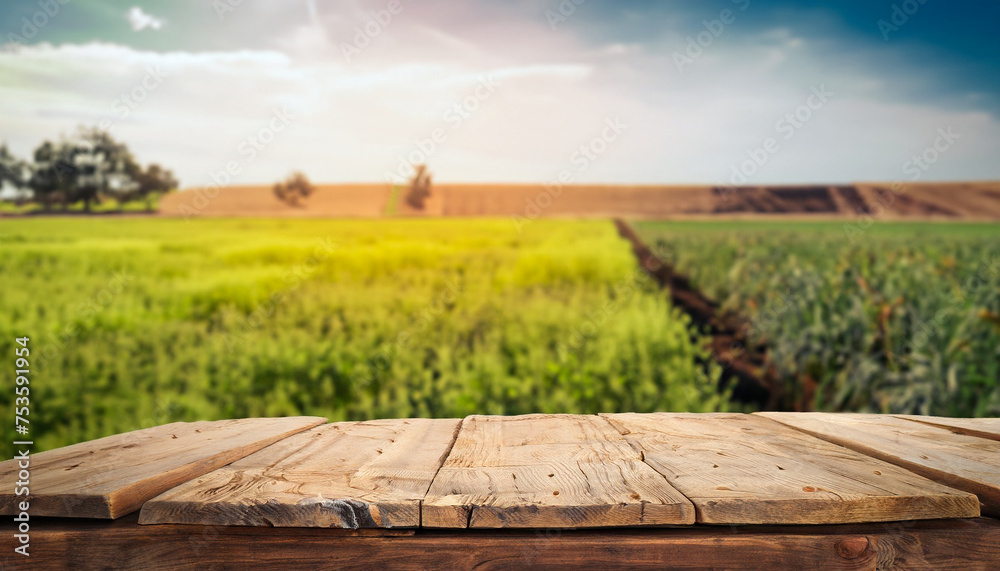 Obraz premium Wooden desk space platform and farm of field background vintage tone. product display, ready to use