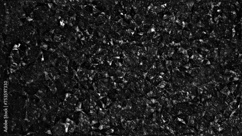 Close-up of black shine asphalt texture with granular surface detail, suitable for background or construction concept, depicting durability and urban infrastructure.