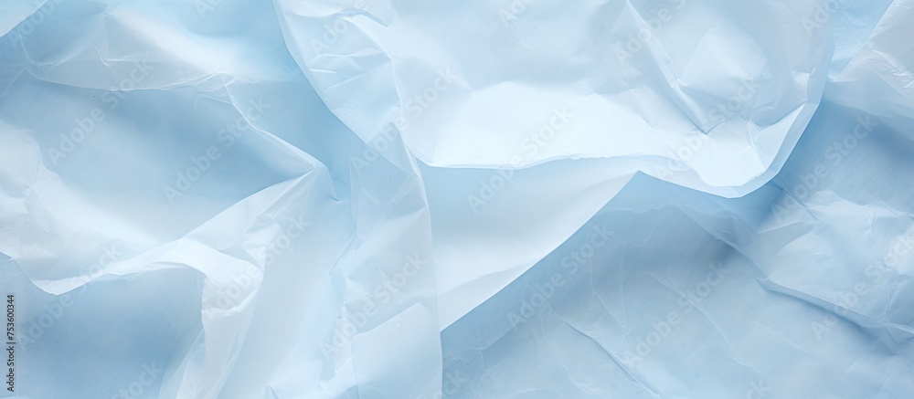 Obraz premium Abstract Blue Background with Intriguing Crumpled Paper Texture for Creative Design Projects