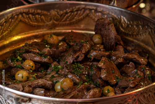 fillet in Madeira sauce with potatoes, bowl with meat, bowl of fillet, stew in a bowl, silver bowls 