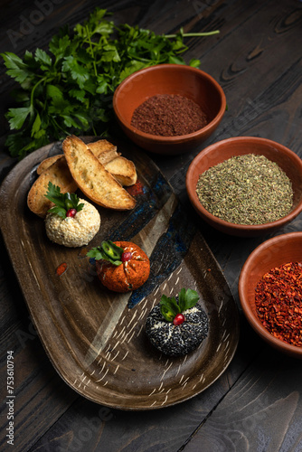 Assortment of appetizers on a dark wooden background. Top view