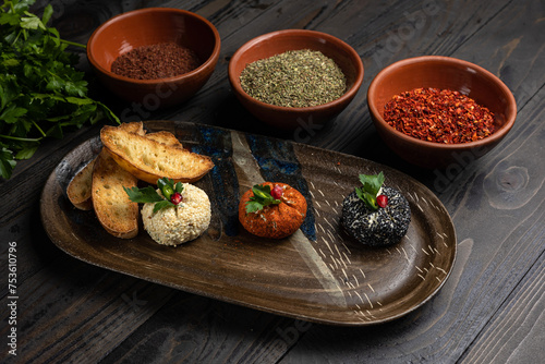 Assortment of appetizers on a dark wooden background. Top view