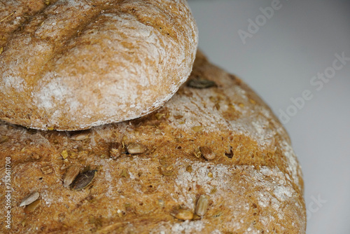 Fotografie Close-up, homemade bread cut with sunflower seeds, pumpkin and oregano