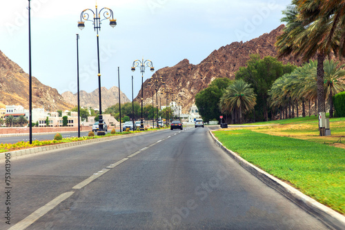 Road among picturesque mountains along the sea. Sultanate of Oman