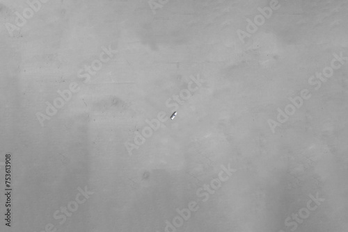 A boat floating over concrete.