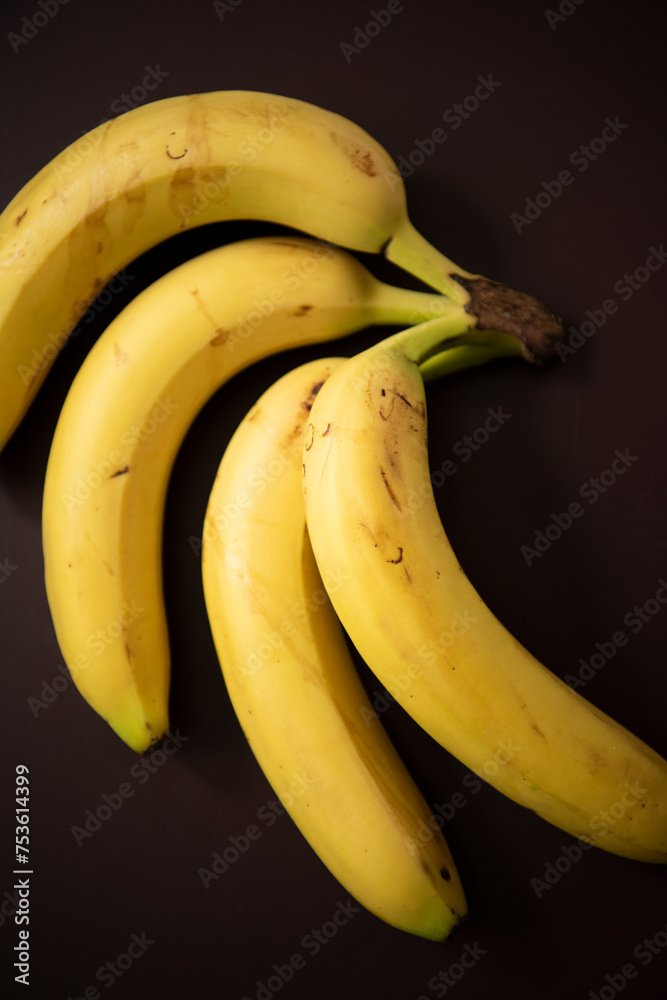 The banana,  an healthy choice of fruit   laid on the table .