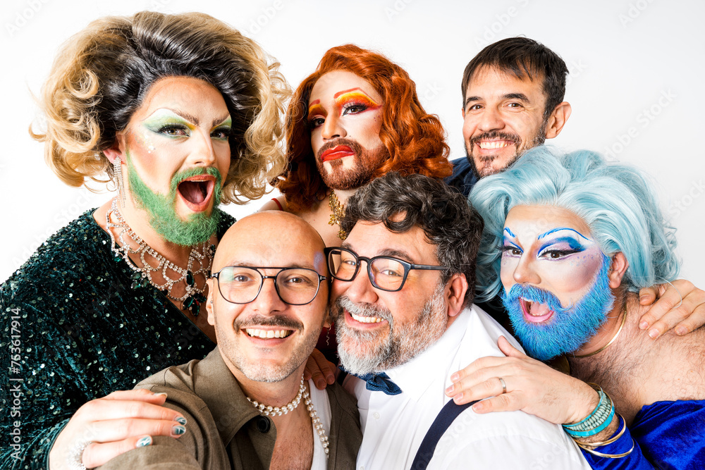 Group of drag queens and queer gay friends posing for picture