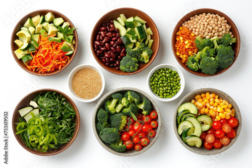 Ingredients in different dishes for buddha bowls or vegetarian cooking including broccoli, carrots, cucumbers and chickpeas, beans and corn
