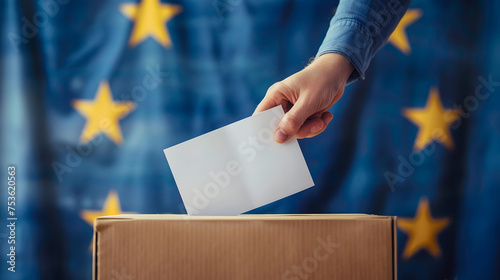 Voting concept - Ballot box on the European Union flag background. Election in European Union. Woman putting her vote in the ballot box. photo