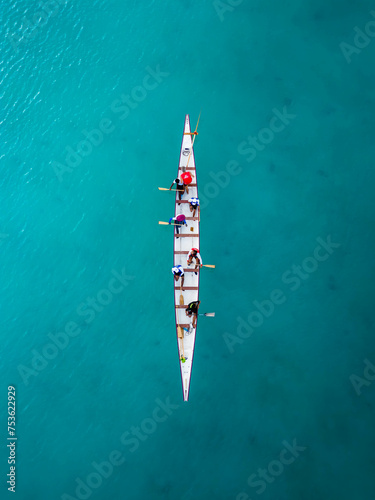 Aerial top view of a sailboat in a turquoise sea © Ashley