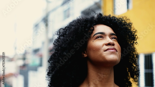 Billede på lærred Believing African American Woman Feeling Presence of Higher Power, Inspired Skyward Close-Up Face looking up in urban setting
