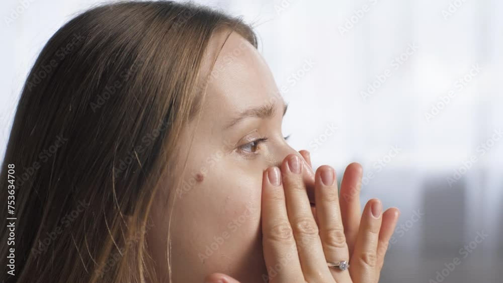 Rubbing cosmetic oil on the face close-up. Facial massage. Beauty care Rubbing cosmetic oil on the face close-up. Facial massage. Beauty care