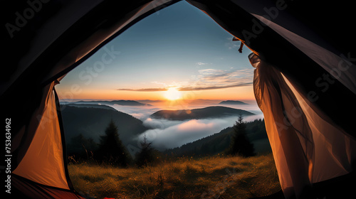 Amazing view of sunrise or sunset from a tent on the mountain