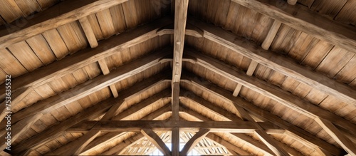 Detail of a natural oak wood roof structure from the rear