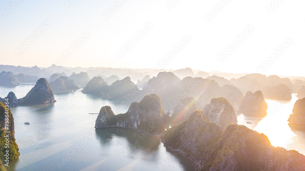 Aerial view floating fishing village and rock island, Halong Bay, Vietnam, Southeast Asia. UNESCO World Heritage Site. Junk boat cruise to Ha Long Bay. Popular landmark, famous destination of Vietnam - obrazy, fototapety, plakaty 